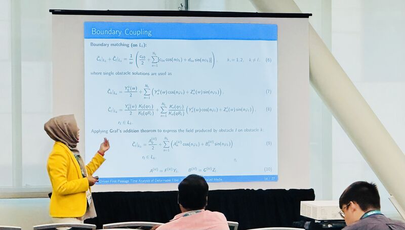 Shomi Aktar presenting mathematical boundary-coupling equations during her SIAM 2026 oral presentation.